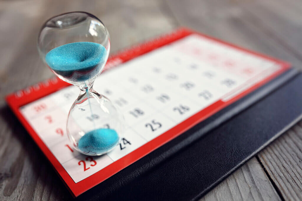 Hour,Glass,On,Calendar,Concept,For,Time,Slipping,Away,For