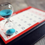 Hour,Glass,On,Calendar,Concept,For,Time,Slipping,Away,For